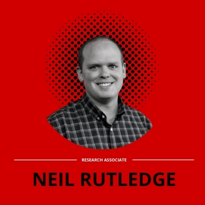 black and white Portrait of Neil Rutledge on a red background